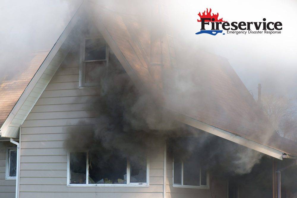 Thick black smoke engulfs a home.