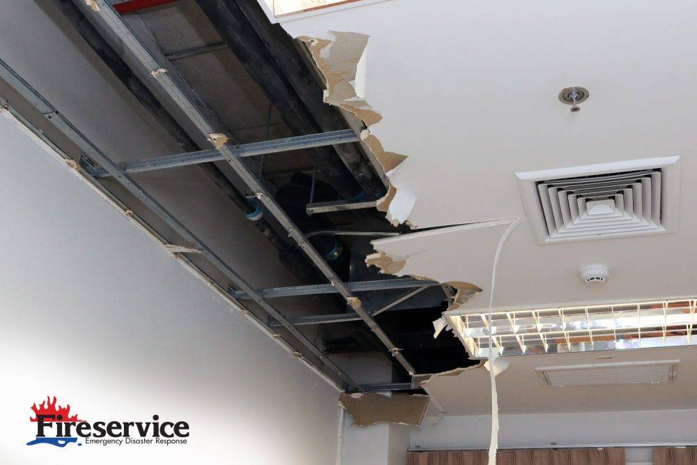 An office ceiling showing significant damage cause by water intrusion.