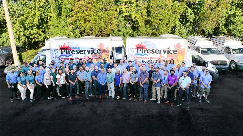 Fire Service USA Team Standing In Front Of Their Truck