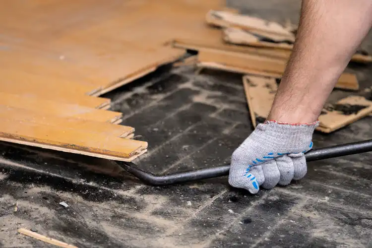 Demolishing a floor with hand tools